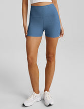 blue high-waisted biker shorts with a 3" inseam.